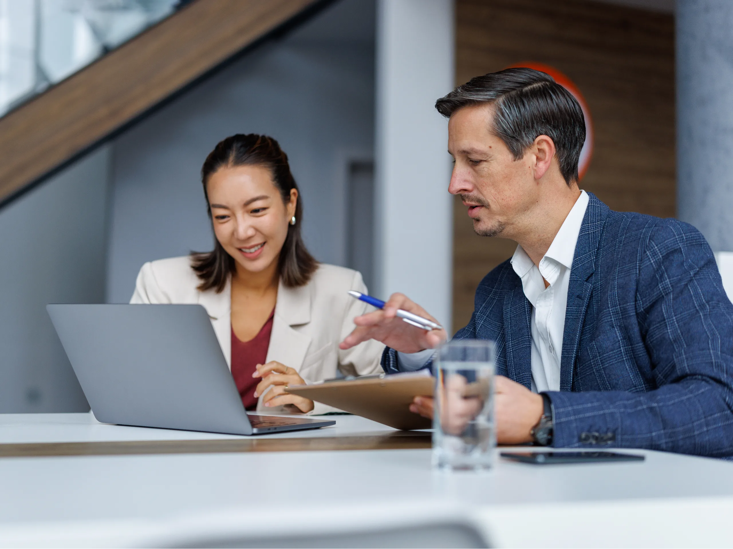 Man and woman looking at laptop