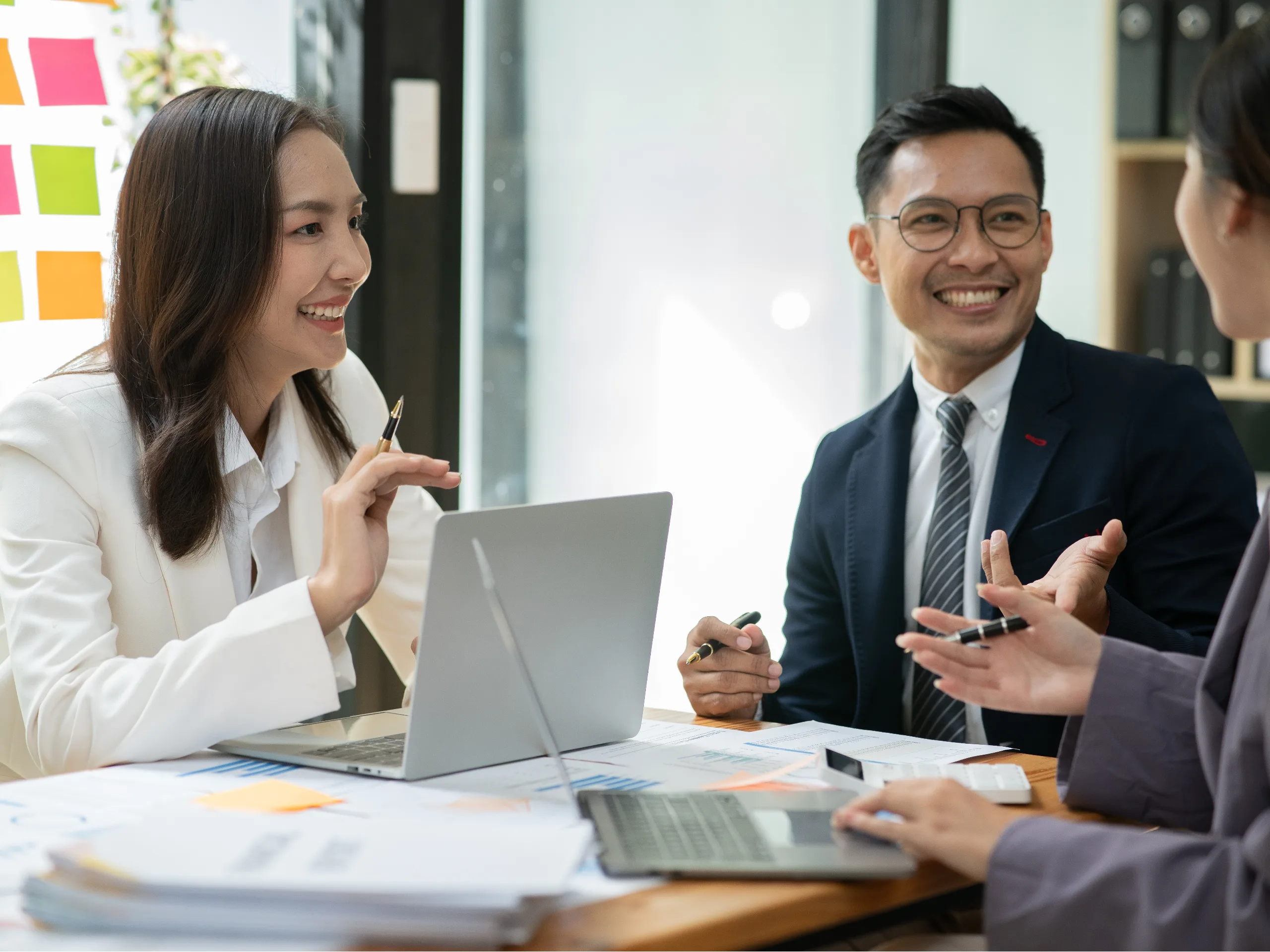 Professionals sitting around a boardroom table